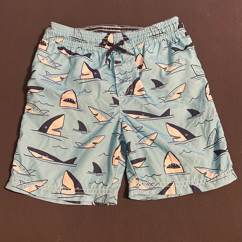 Carter’s 5T boys swim trunks. Blue with shark print.
